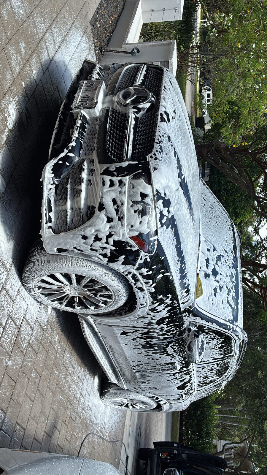 Electric sedan foam wash
